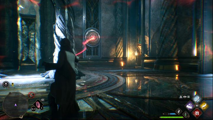 There is an interactive switch on the right side - hit it with a basic spell - it will turn the magical gate 180 degrees - Hogwarts Legacy: Charles Rookwoods Trial - Main quests - Hogwarts Legacy Guide